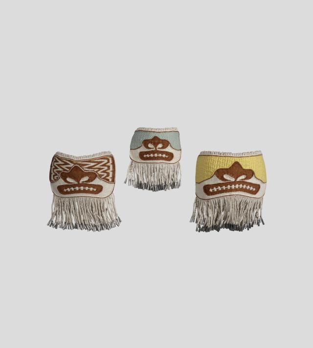 Three woven, ornamental masks