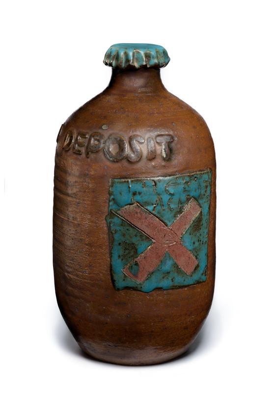 Earthenware bottle with an X on the front.