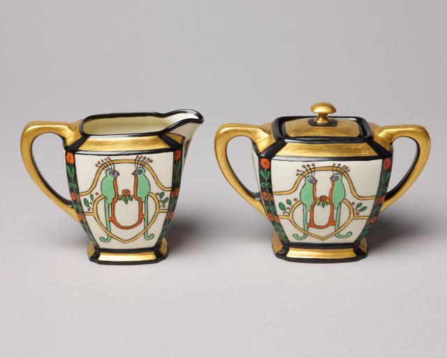 Hand-painted porcelain sugar and creamer set.