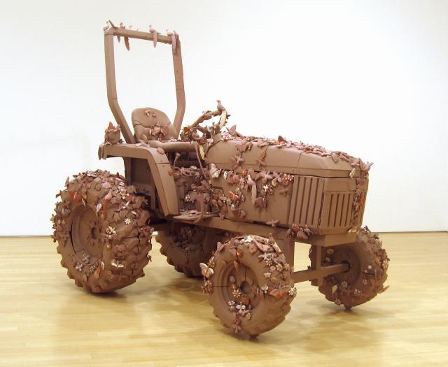 Tractor model made of clay and metal.
