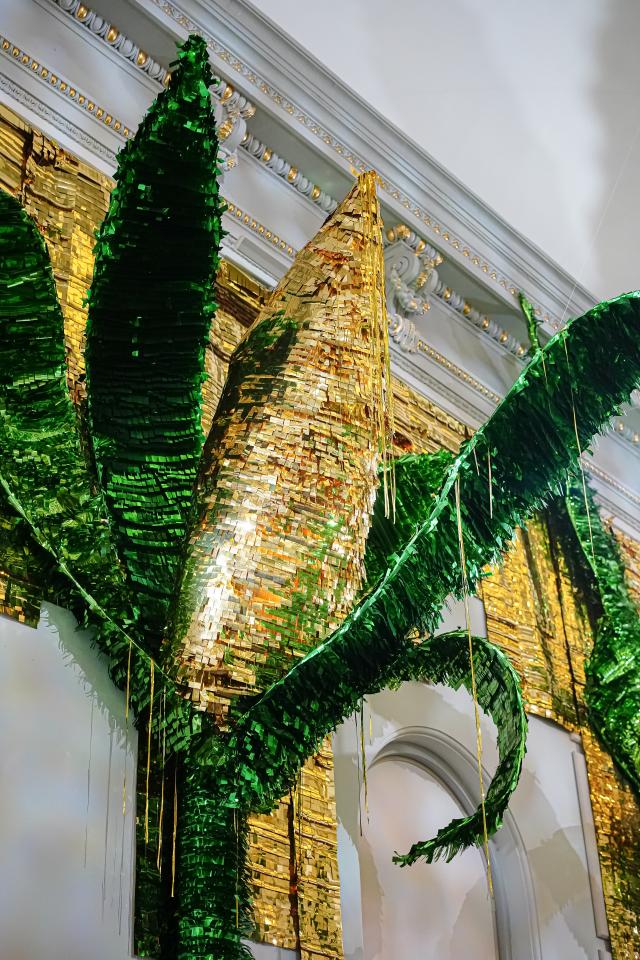 Large-scale installation of corncob piñatas.