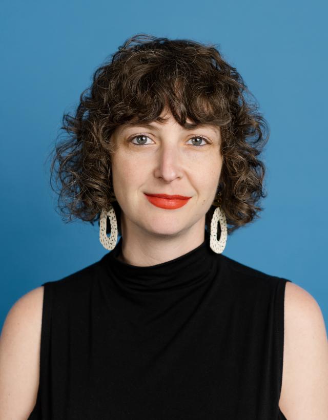Portrait of a person against a blue background