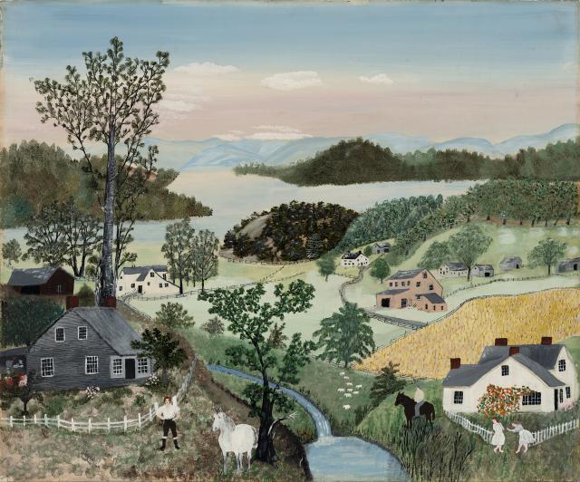 A landscape with rolling hills and houses.