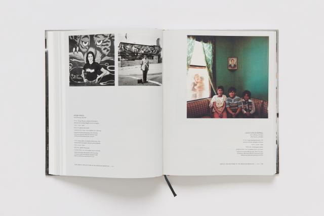 An opened book of a photography catalogue.