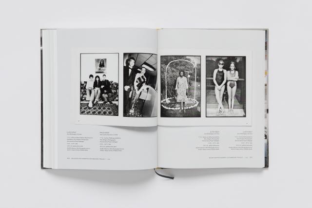 An opened book of a photography catalogue.