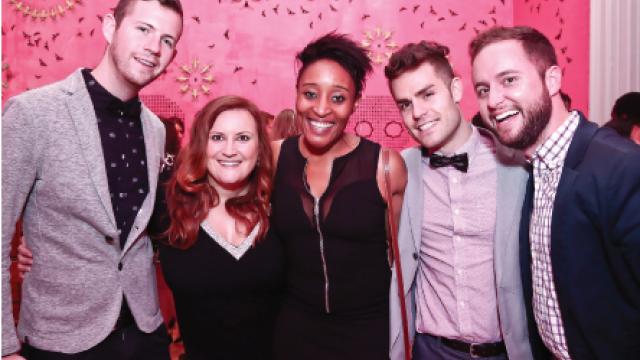 A group of young people pose for a photograph