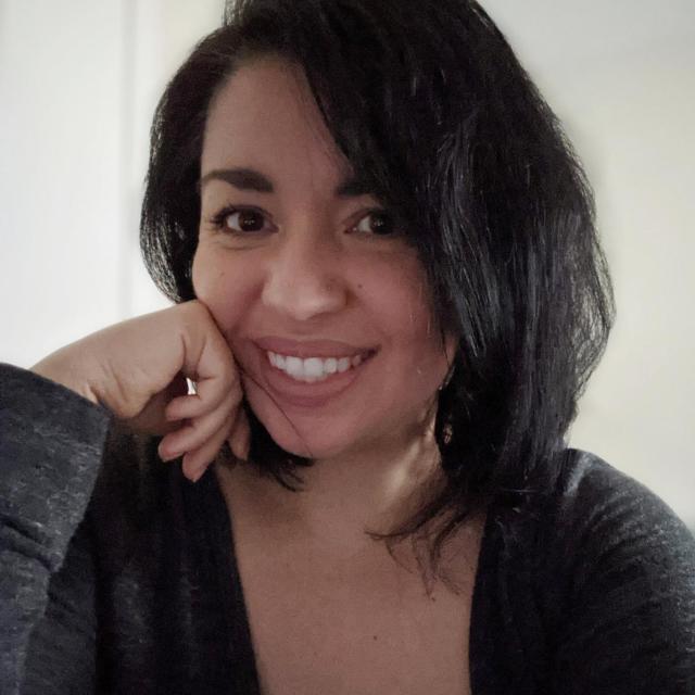 Headshot of woman with black hair