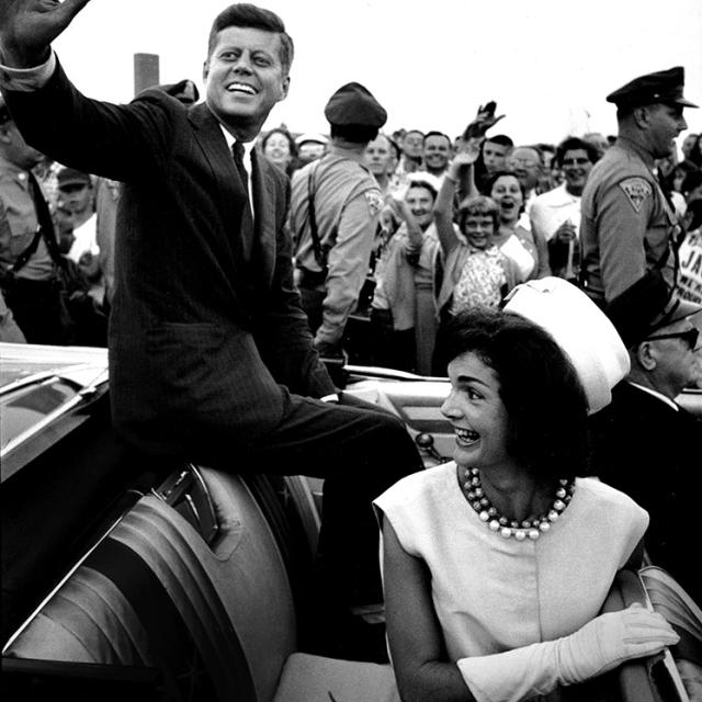 Senator Kennedy waving from car