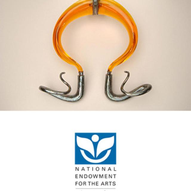 This is a sterling silver and polyester resin neckpiece 