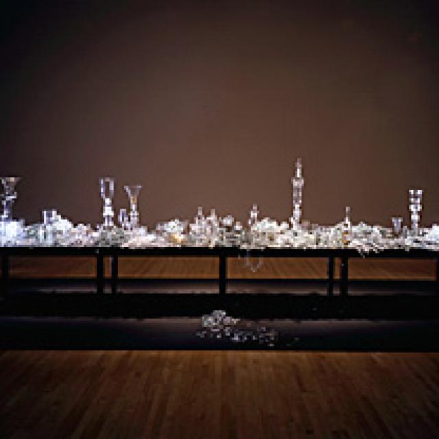 hand sculpted and blown glass arranged on a table. 