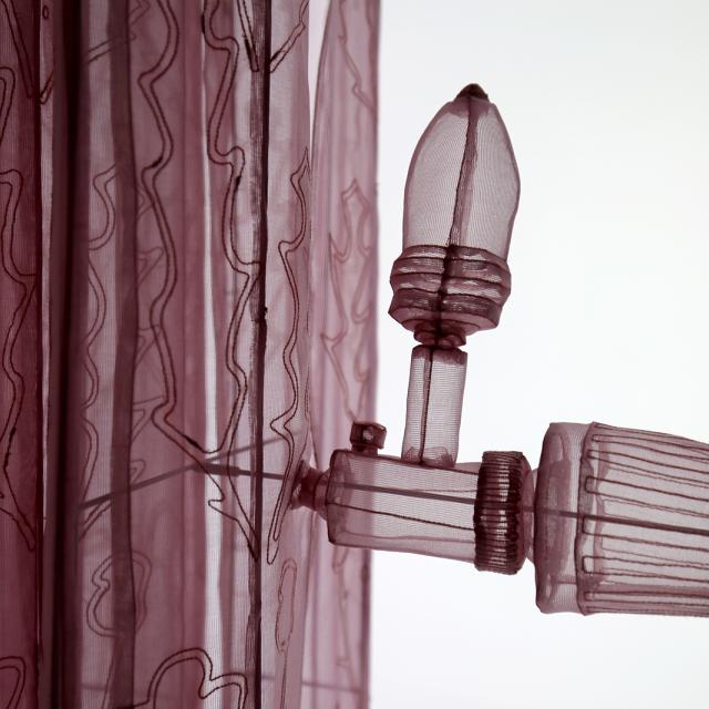 This is a photograph of Do Ho Suh's radiator made of mesh.