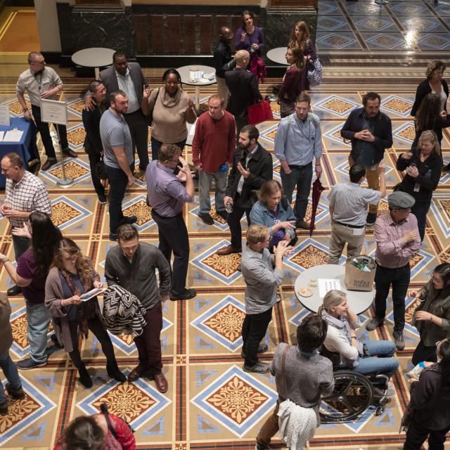 A photo of a group of museum visitors at the first ASL Happy Hour