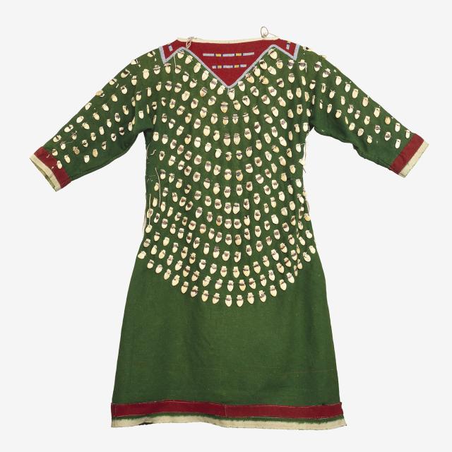 A green dress with beads and red highlights. 