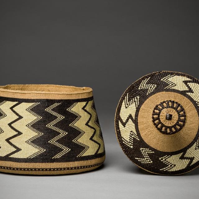 A basket made of black and white materials. 