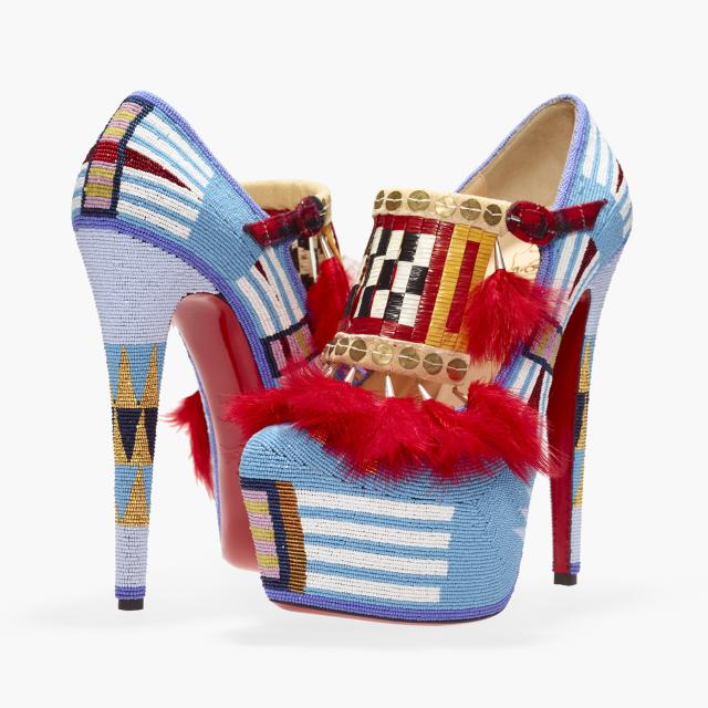 Two high heel shoes made fro beads, sequins, feathers and other items. 
