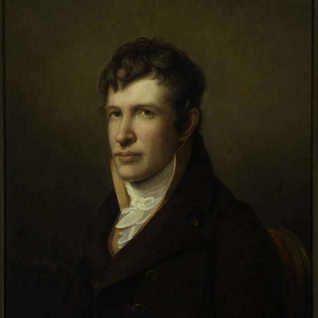 A portrait of a man sitting. 