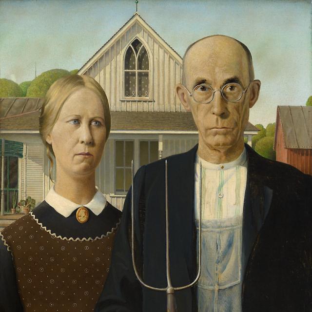 An image of a woman and a man with a house behind them. The man is holding a rake.