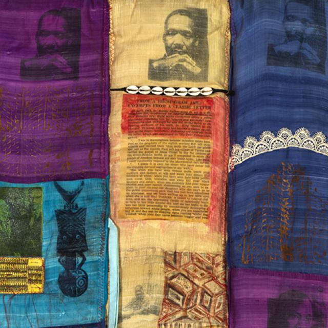Detail of a quilt featuring images of Martin Luther King Jr.