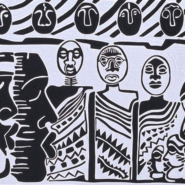Detail of black and white quilt with rows of stylized human figures.