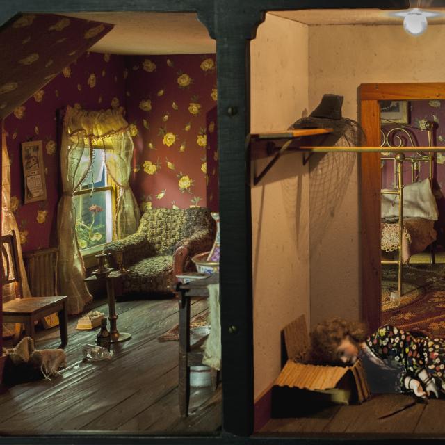 The image shows a view of two room of one of the doll houses