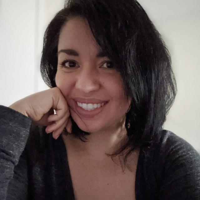 Headshot of woman with black hair